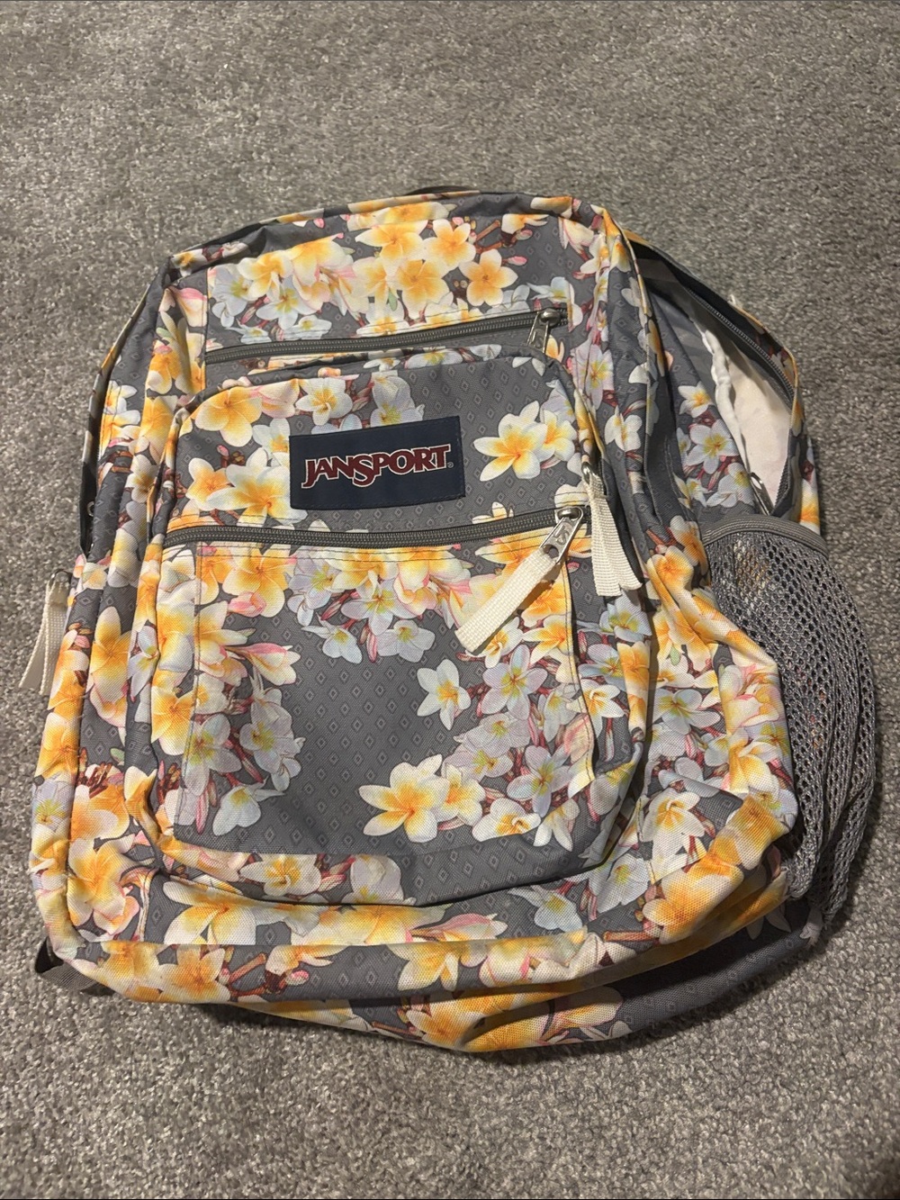 JanSport Gray Backpack with Yellow Floral Plumeria Print
